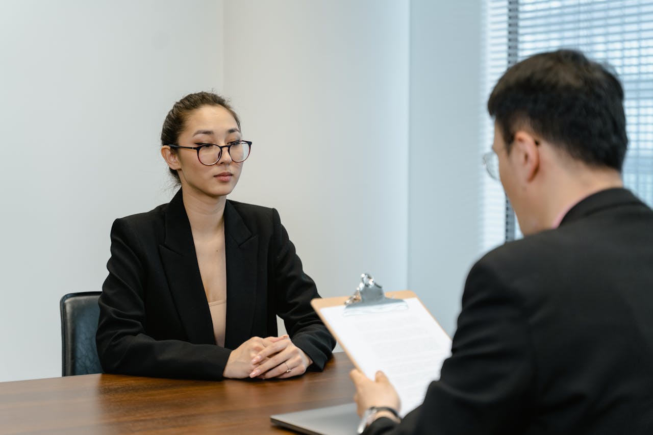 Business interview scene with professionals in office setting.